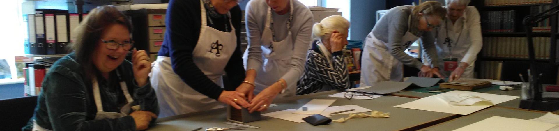 Truro Society volunteers at The Courtney Library receiving training